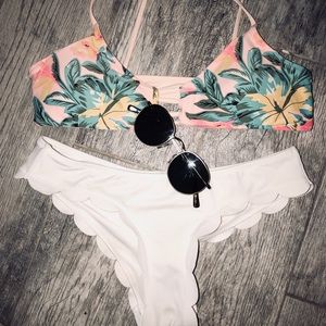 Hawaiian top and white ruffle bottoms.